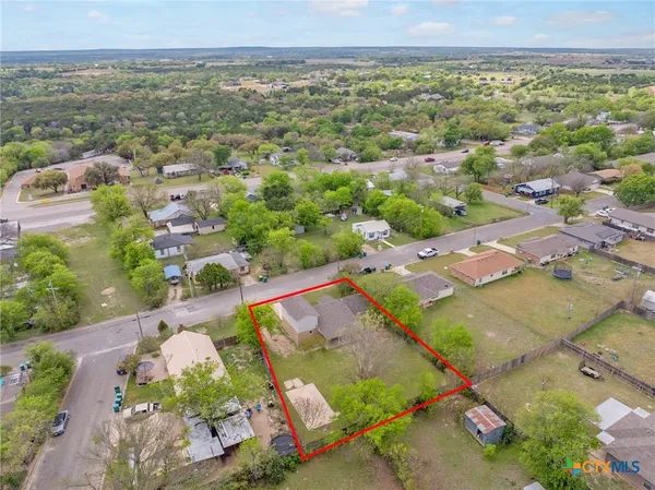 an aerial view of residential houses with outdoor space