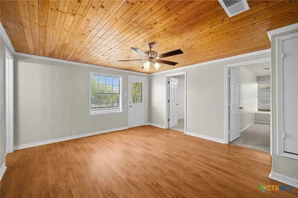 a view of an empty room with a window