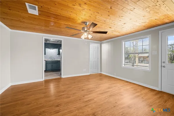 a view of an empty room with a window