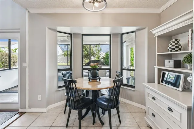 a living room with furniture a rug and a table
