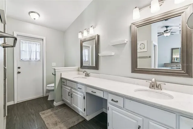 a view of a hallway with closet and a window