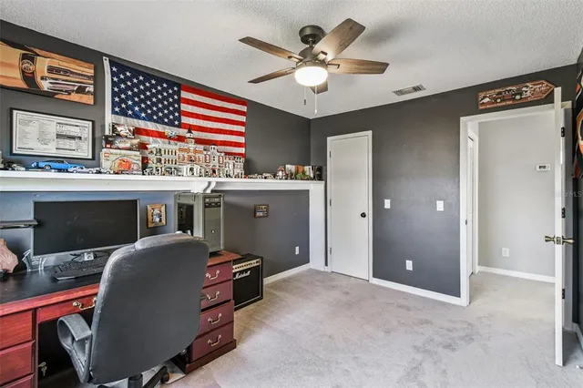 an aerial view of a house with a swimming pool yard and outdoor seating