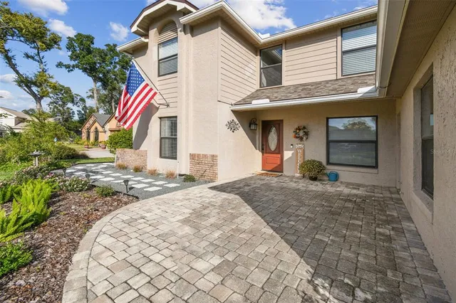 a view of a dining room with furniture wooden floor and chandelier