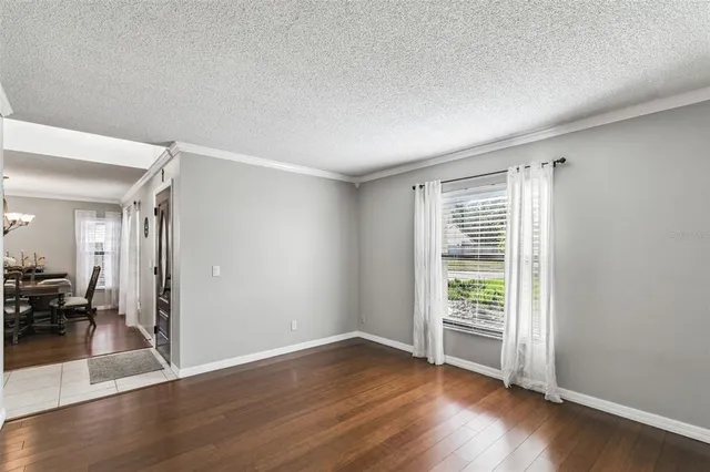 a kitchen with stainless steel appliances kitchen island granite countertop a sink stove and refrigerator