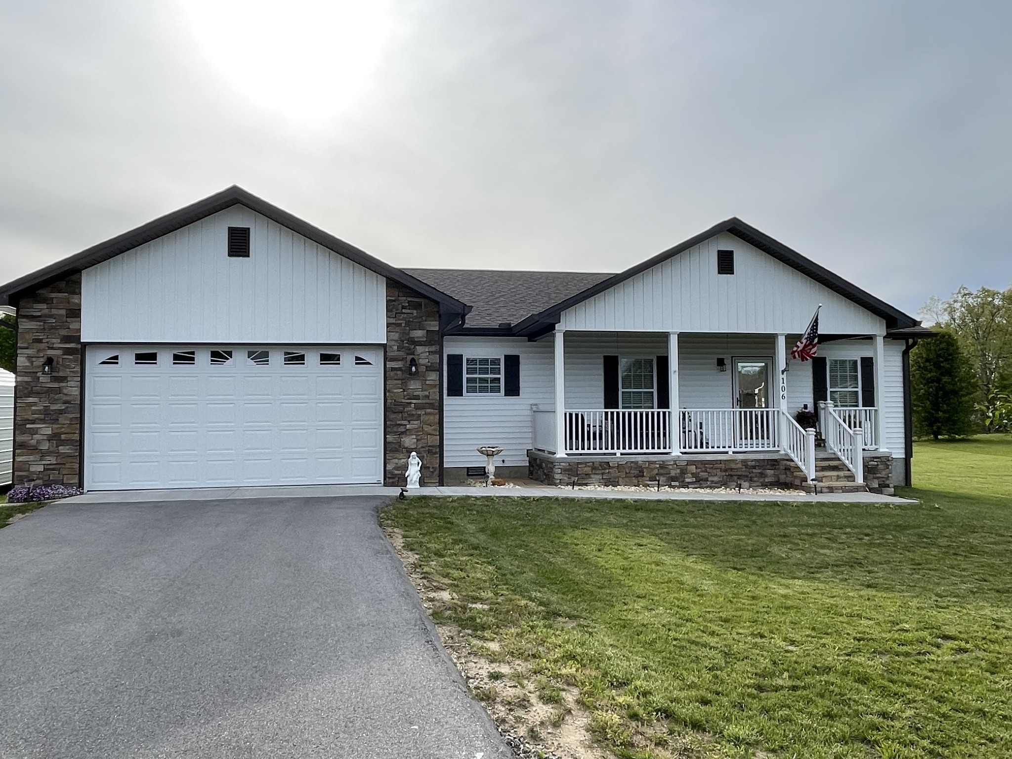 106 Maca Ridge Circle Clarkrange, TN 38553 - Photo 1 of 39 a front view of a house with a yard and garage