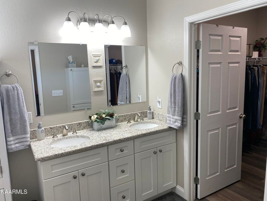 106 Maca Ridge Circle Clarkrange, TN 38553 - Photo 19 of 39 a bathroom with a granite countertop sink and a mirror