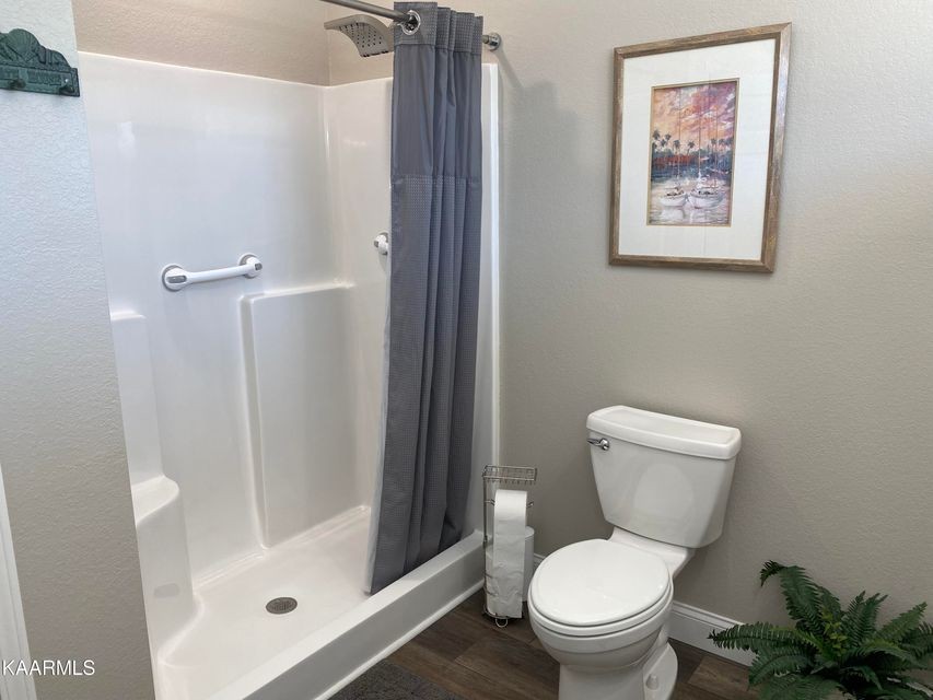 106 Maca Ridge Circle Clarkrange, TN 38553 - Photo 20 of 39 a white toilet sitting next to a bathroom sink