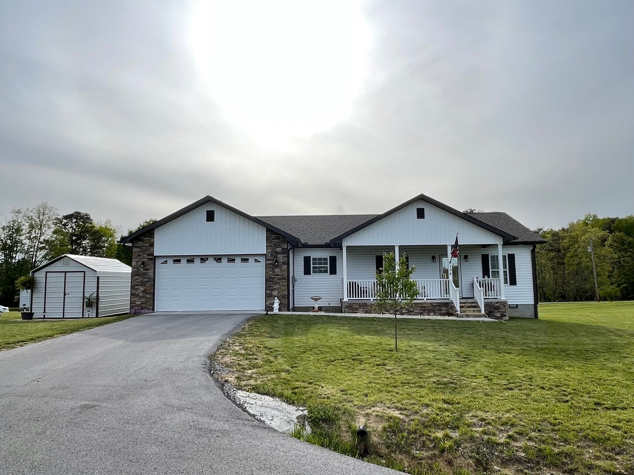 106 Maca Ridge Circle Clarkrange, TN 38553 - Photo 2 of 39 a front view of a house with a yard garage and outdoor seating
