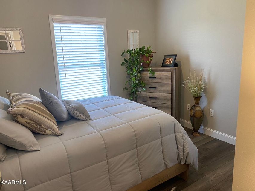 106 Maca Ridge Circle Clarkrange, TN 38553 - Photo 27 of 39 a bedroom with a bed and a potted plant