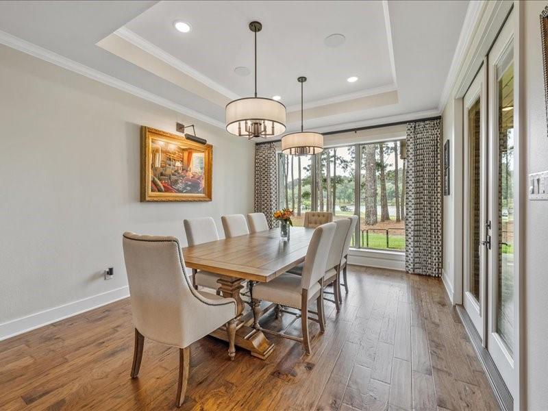 8595 Toler Pointe Larue, TX 75770 - Photo 20 of 40 Formal dining area with custom draperies and tray ceiling. Double doors that can be open on a cool evening.