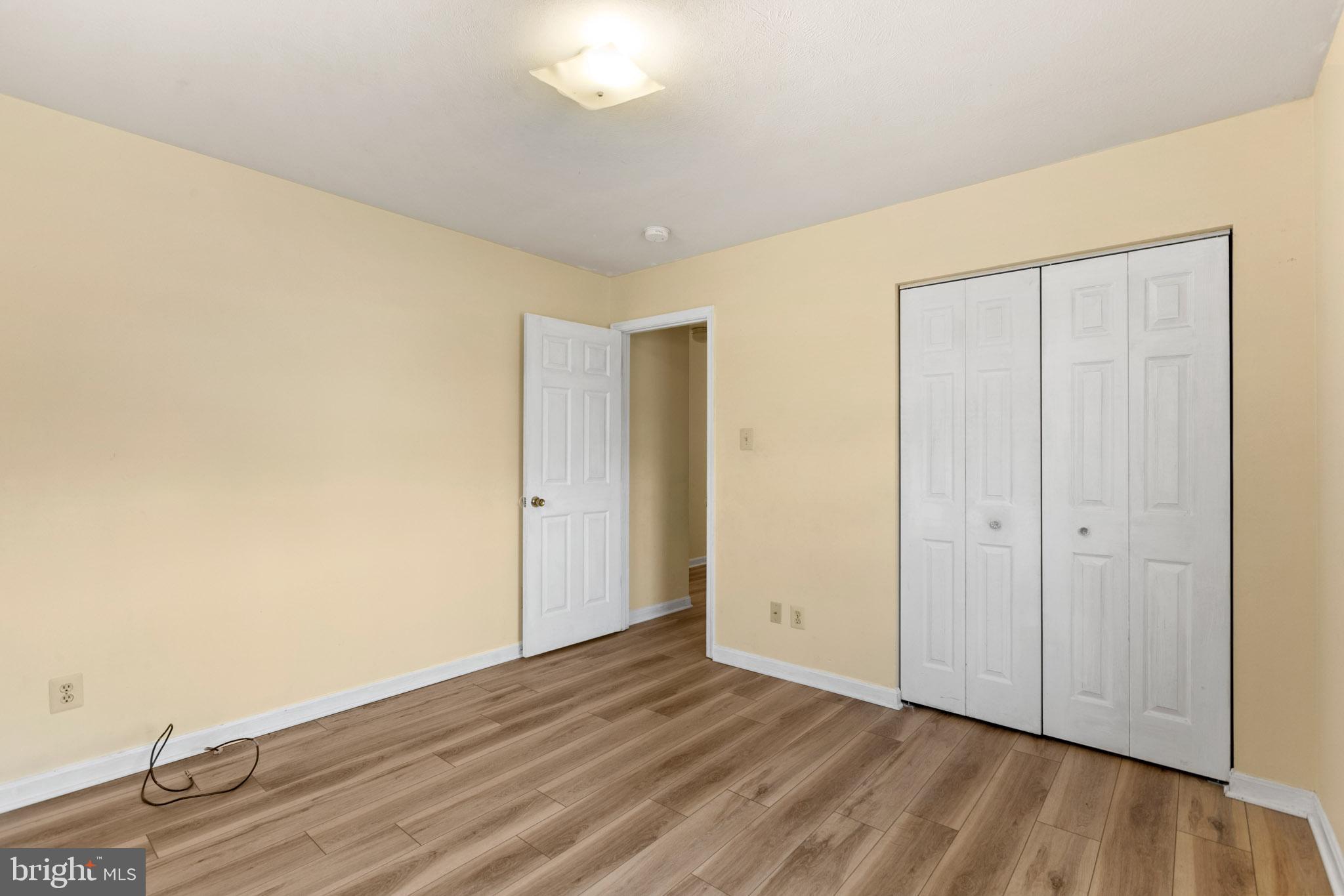 45246 Coledorall Court California, MD 20619 - Photo 12 of 21 a view of an empty room and wooden floor