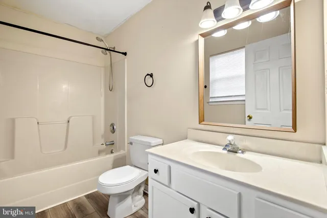 a bathroom with a sink toilet tub and shower
