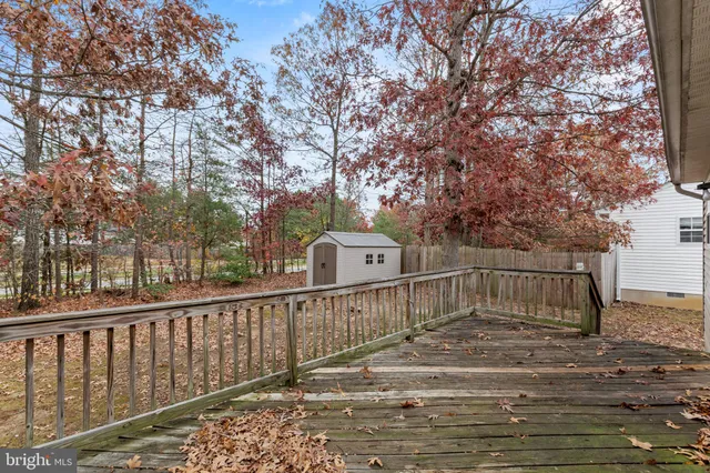 a view of a deck with a yard