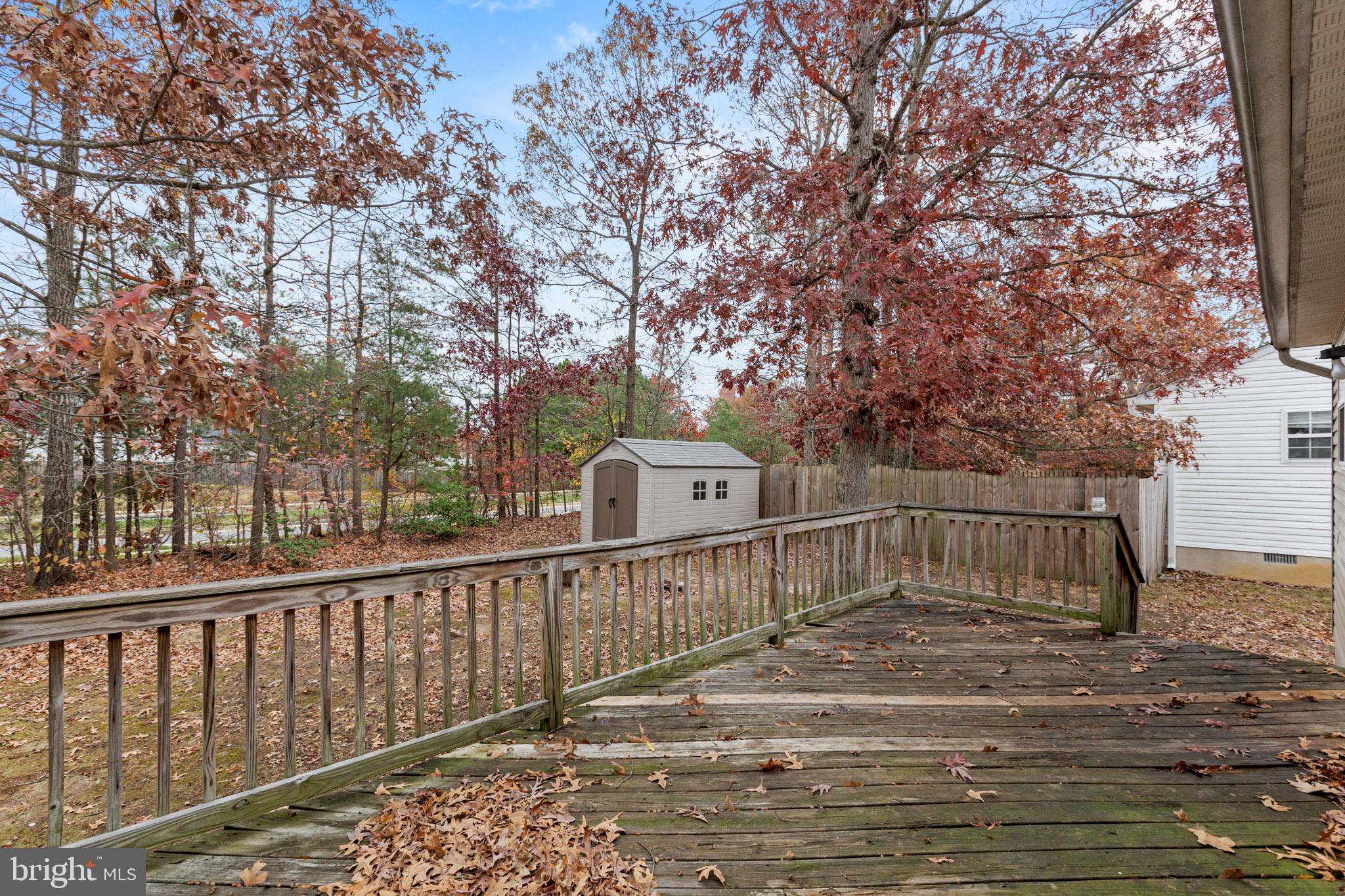 45246 Coledorall Court California, MD 20619 - Photo 18 of 21 a view of a deck with a yard