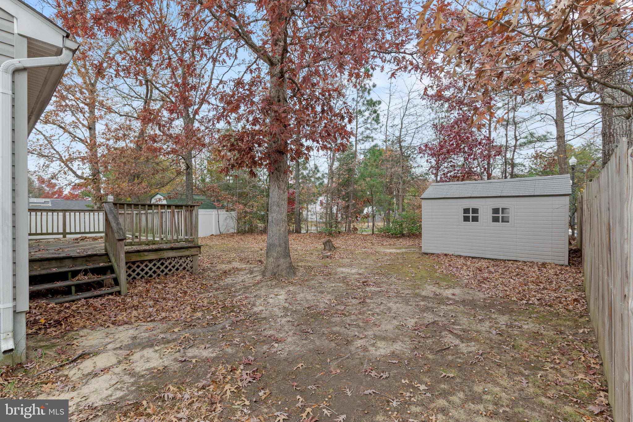45246 Coledorall Court California, MD 20619 - Photo 19 of 21 a view of a house with a yard and tree s