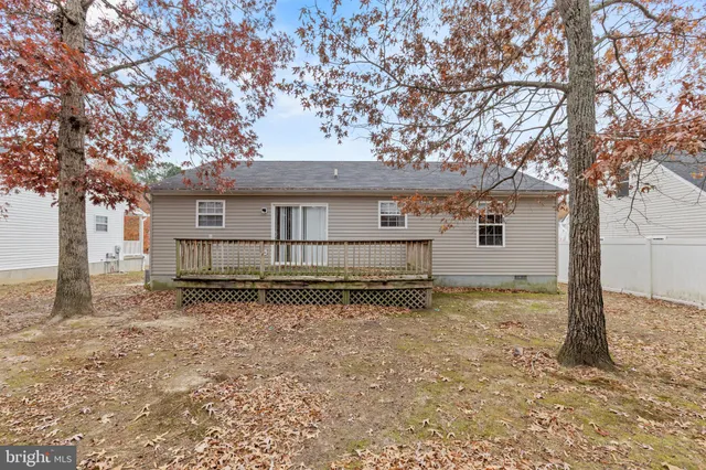 a house with trees in the background
