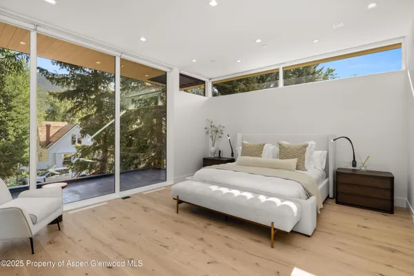 a bedroom with a bed and a fireplace