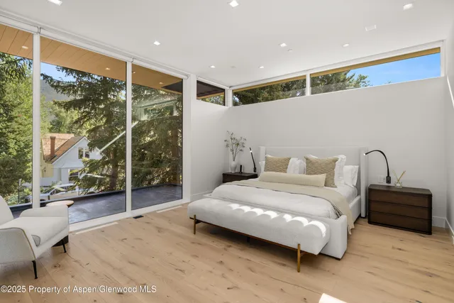 a bedroom with a bed and a fireplace