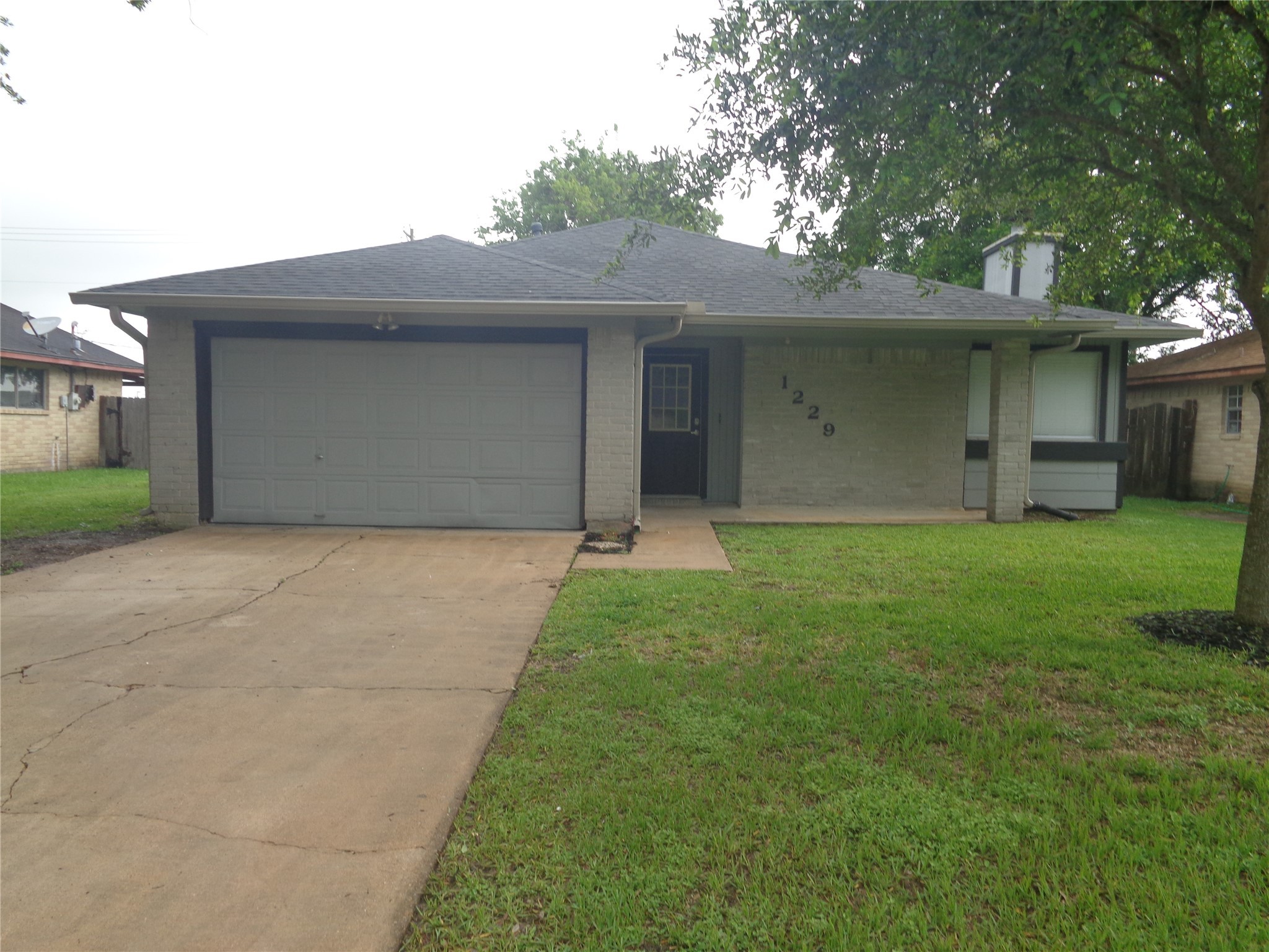 1229 Clover Drive Angleton, TX 77515 - Photo 1 of 7 a house that is sitting in the grass