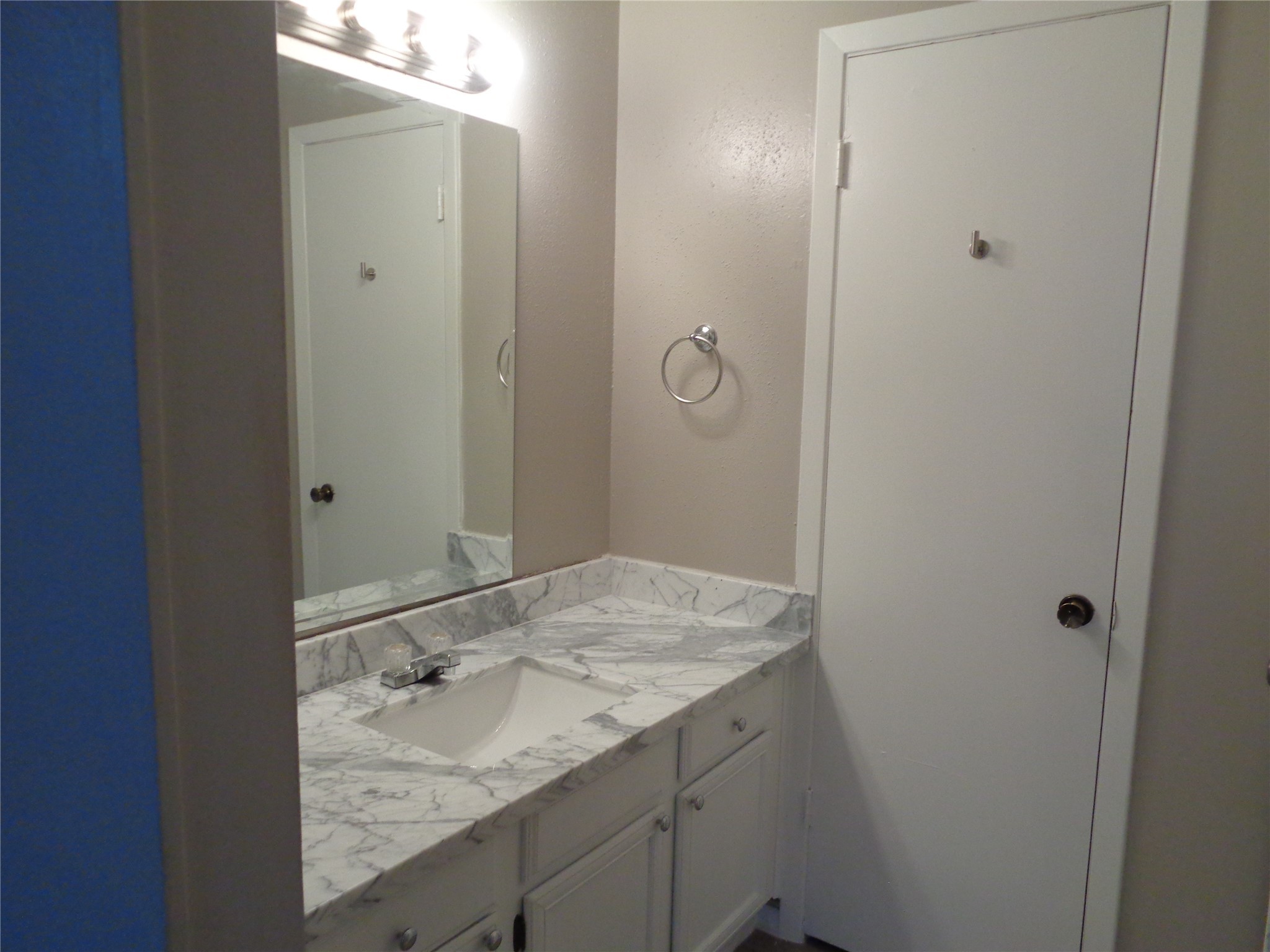 1229 Clover Drive Angleton, TX 77515 - Photo 5 of 7 a bathroom with a granite countertop sink and mirror