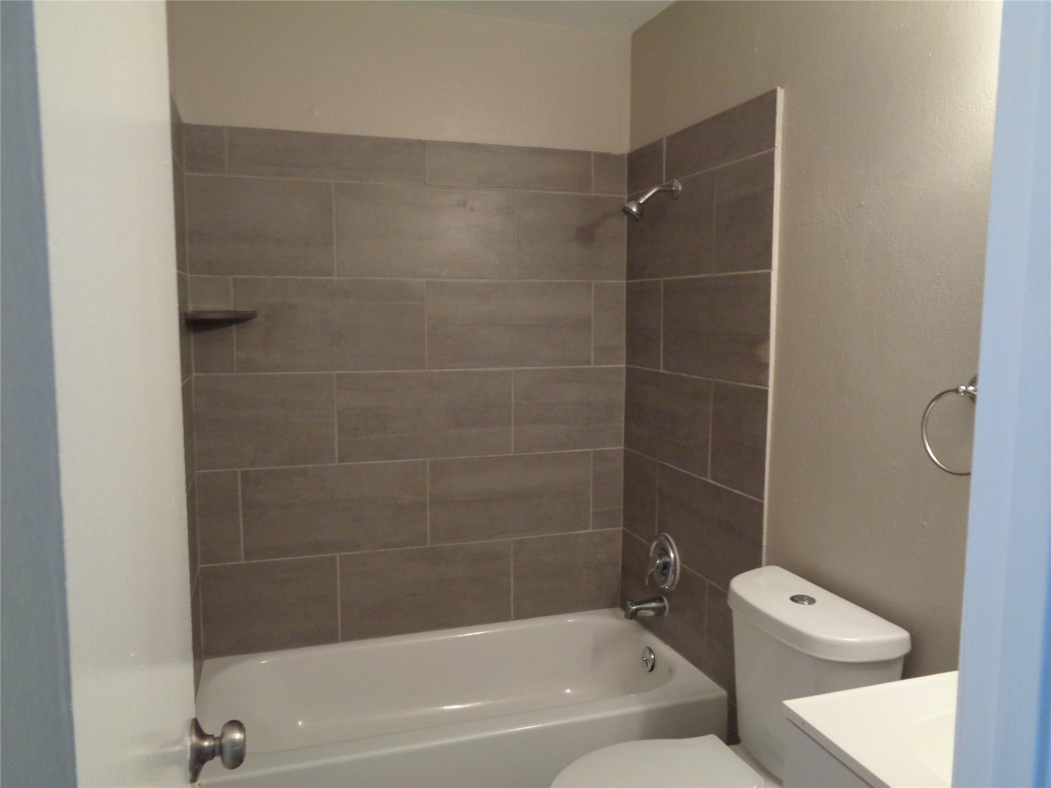 1229 Clover Drive Angleton, TX 77515 - Photo 6 of 7 a bathroom with a toilet and shower