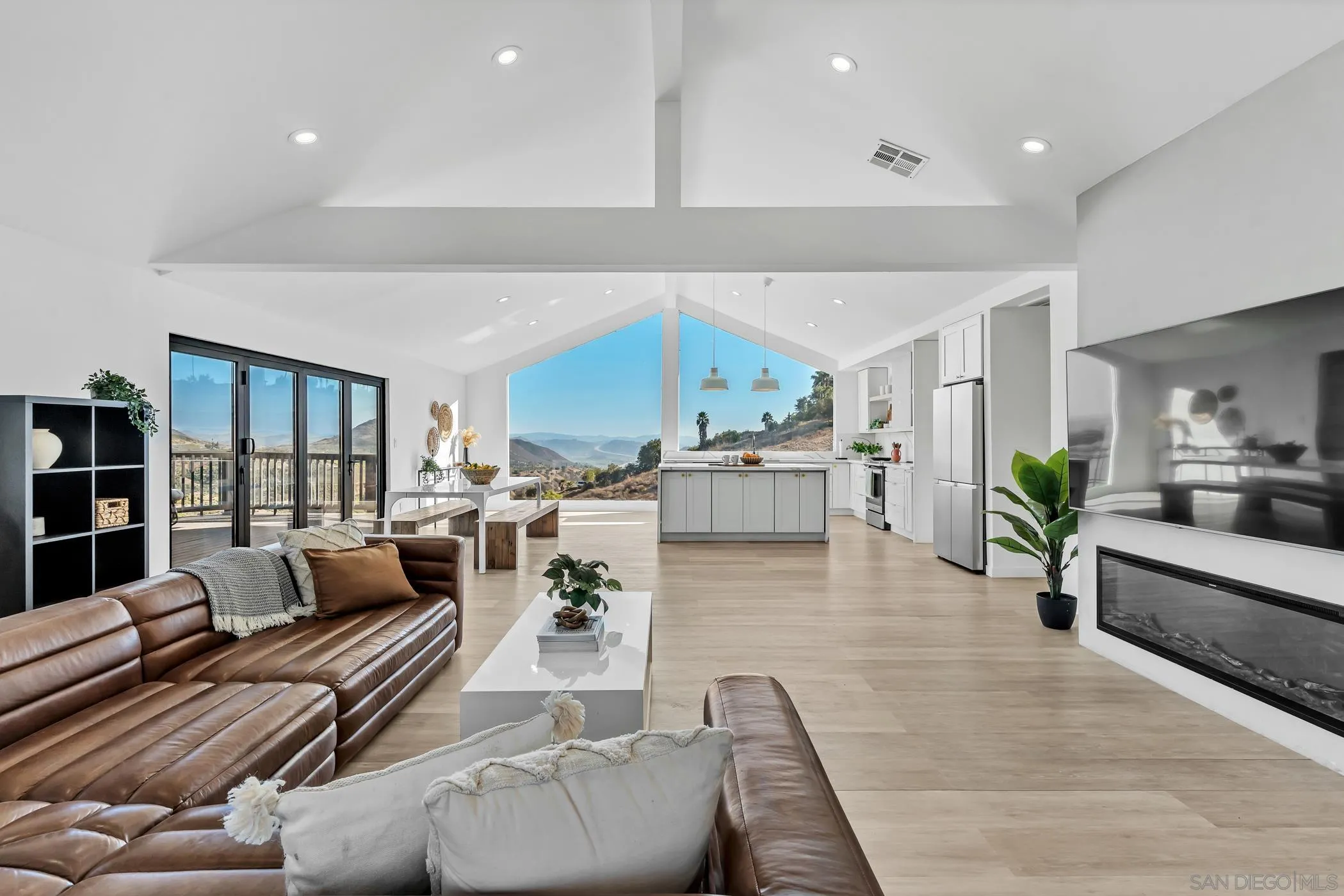 1029 Rainbow Valley Court Fallbrook, CA 92028 - Photo 21 of 75 a living room with furniture and view of kitchen