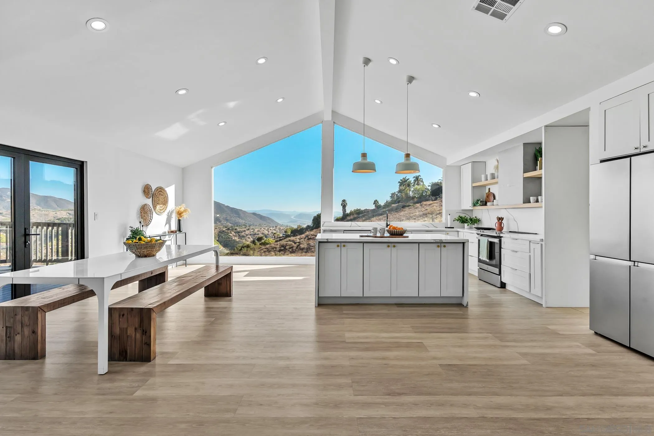 1029 Rainbow Valley Court Fallbrook, CA 92028 - Photo 25 of 75 a kitchen with stainless steel appliances kitchen island granite countertop a stove and a sink