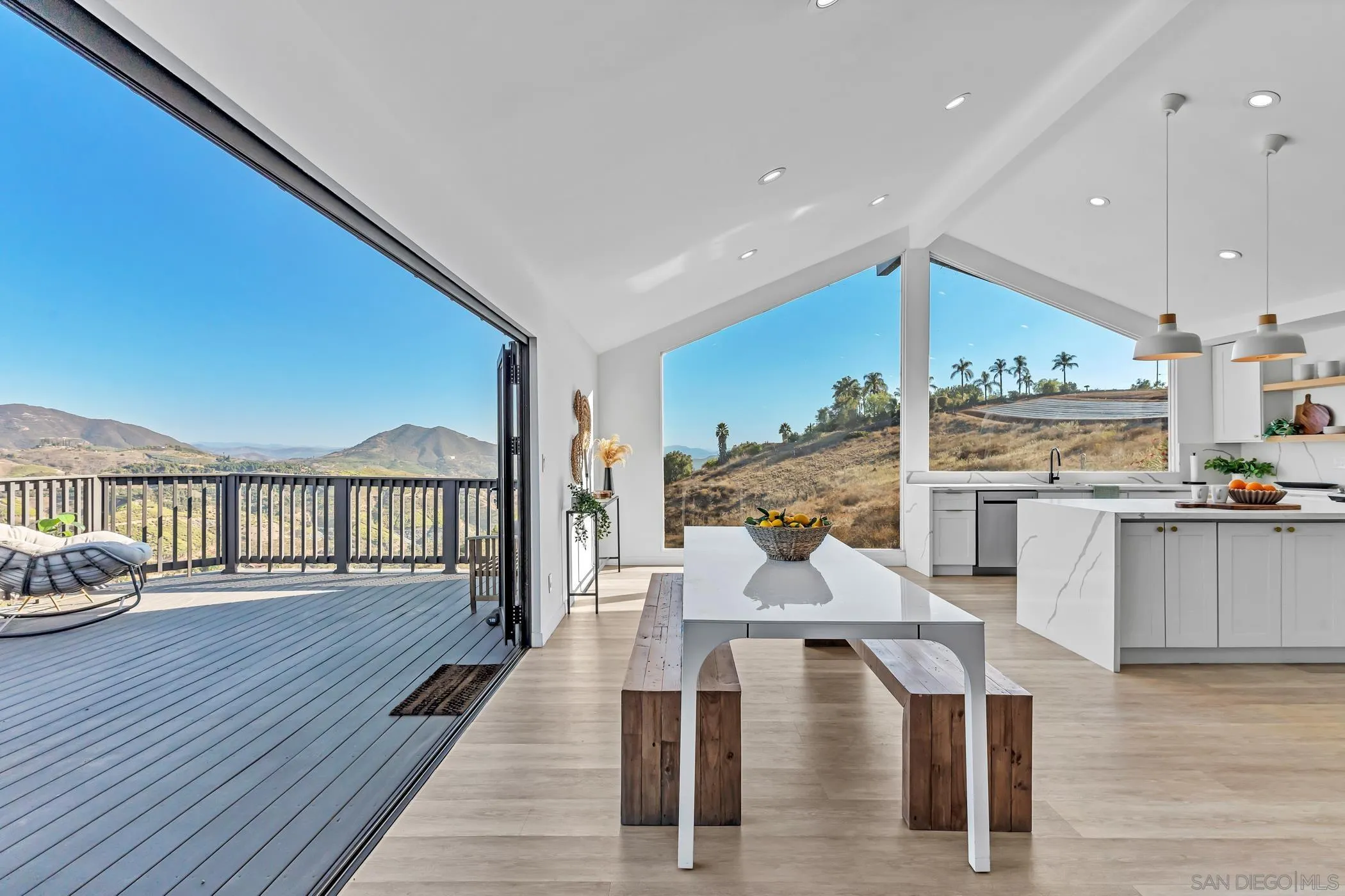 1029 Rainbow Valley Court Fallbrook, CA 92028 - Photo 30 of 75 a living room with furniture and kitchen view with wooden floor