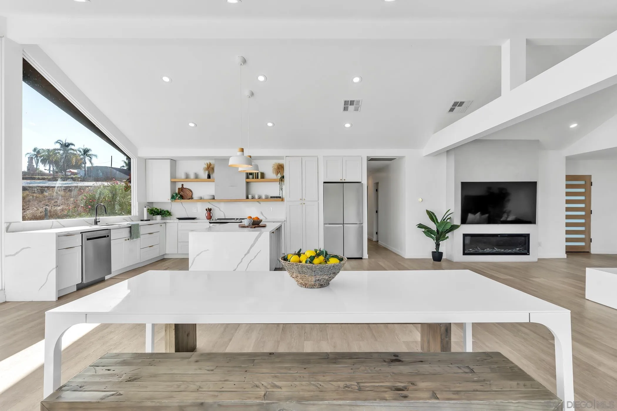 1029 Rainbow Valley Court Fallbrook, CA 92028 - Photo 32 of 75 a living room with stainless steel appliances furniture fireplace and flat screen tv