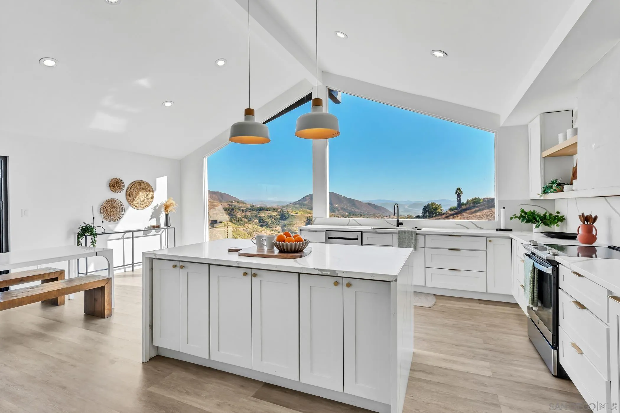 1029 Rainbow Valley Court Fallbrook, CA 92028 - Photo 37 of 75 a kitchen with white cabinets and sink