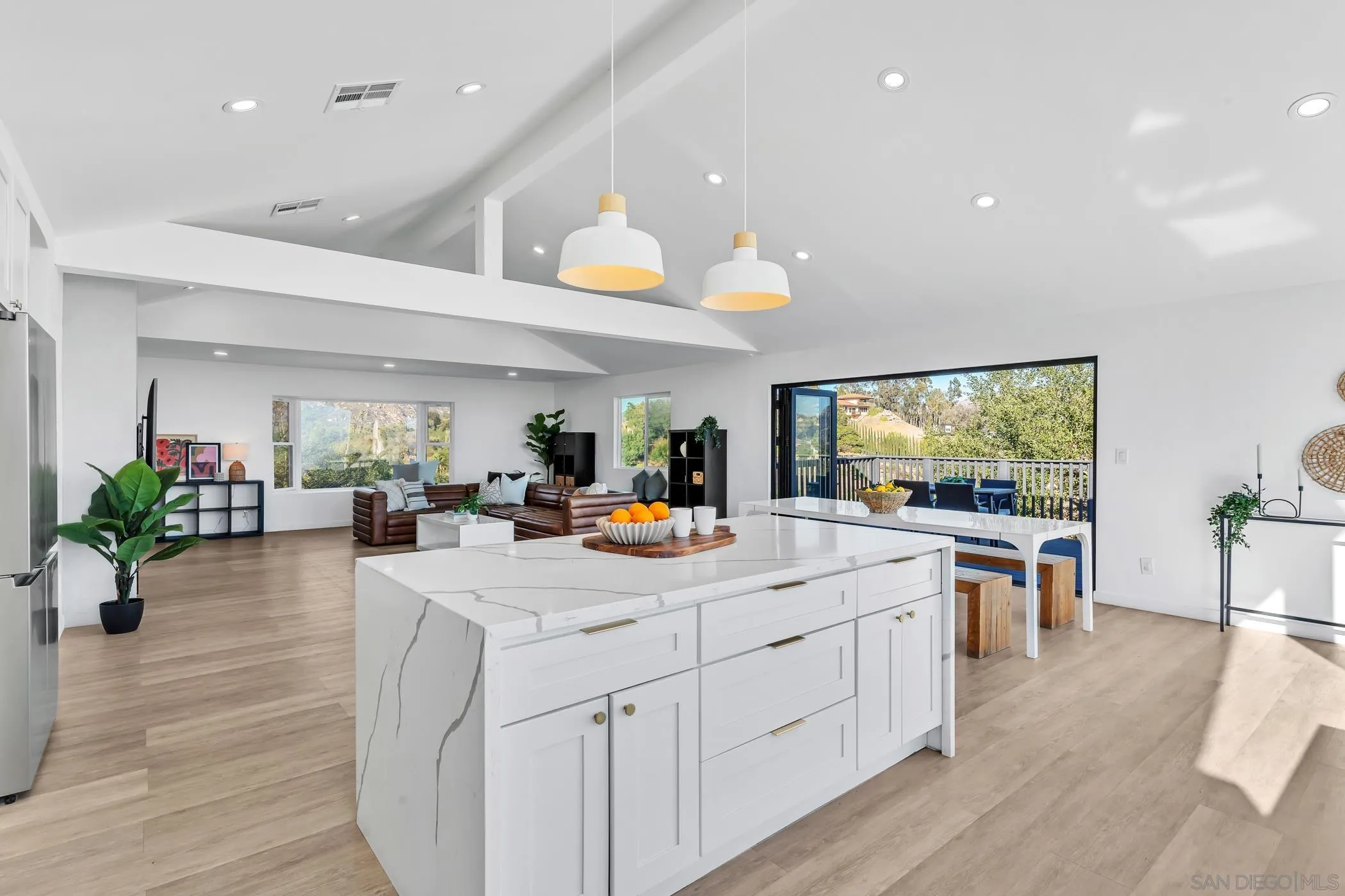 1029 Rainbow Valley Court Fallbrook, CA 92028 - Photo 39 of 75 a view of living room kitchen with stainless steel appliances furniture stove and wooden floor
