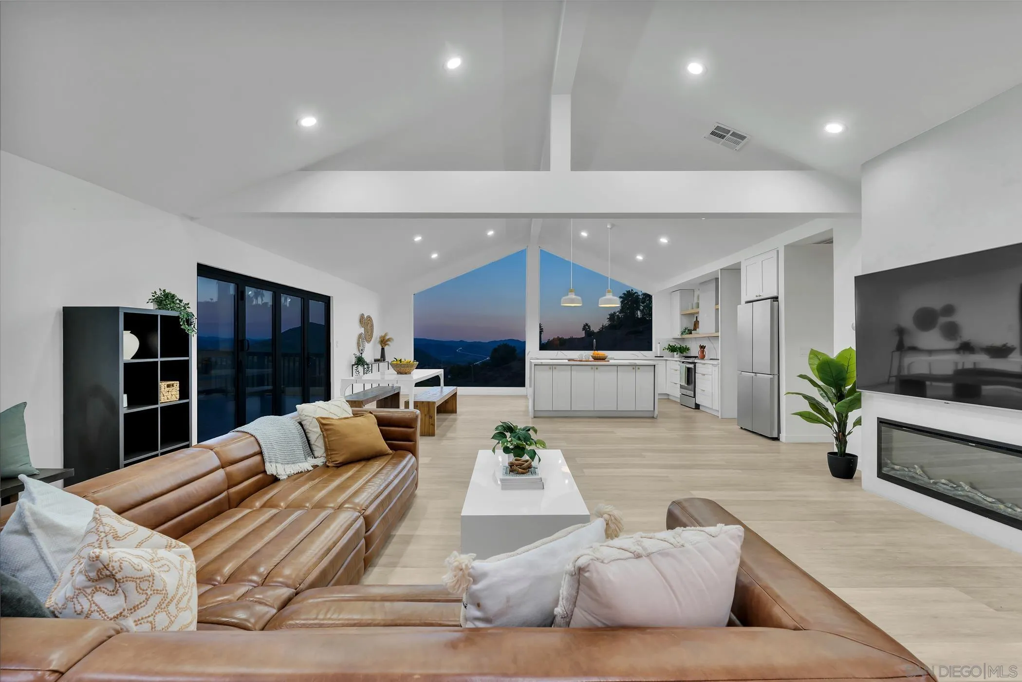 1029 Rainbow Valley Court Fallbrook, CA 92028 - Photo 4 of 75 a living room with furniture kitchen view and a potted plant