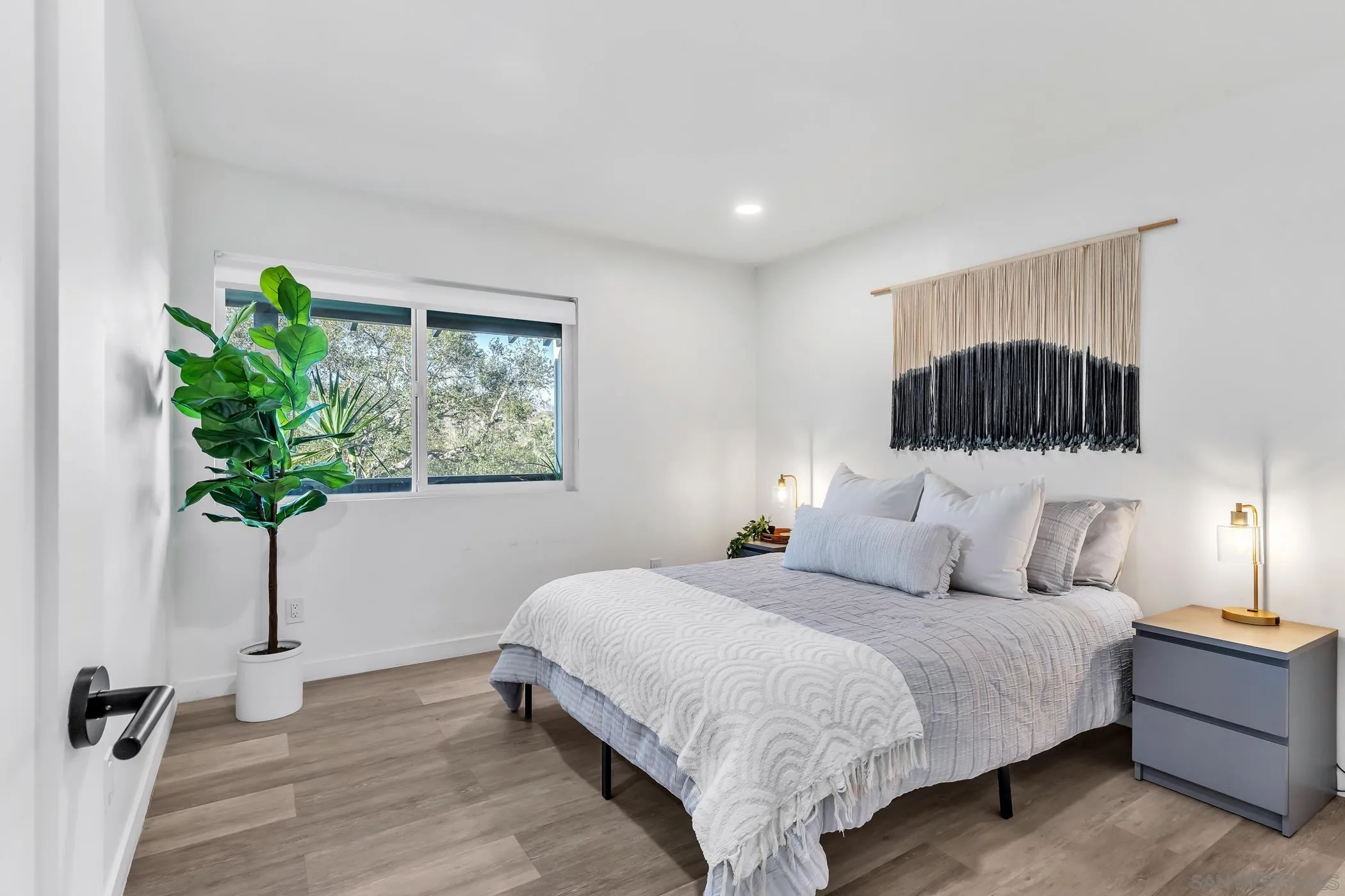 1029 Rainbow Valley Court Fallbrook, CA 92028 - Photo 43 of 75 a bedroom with a bed and a potted plant