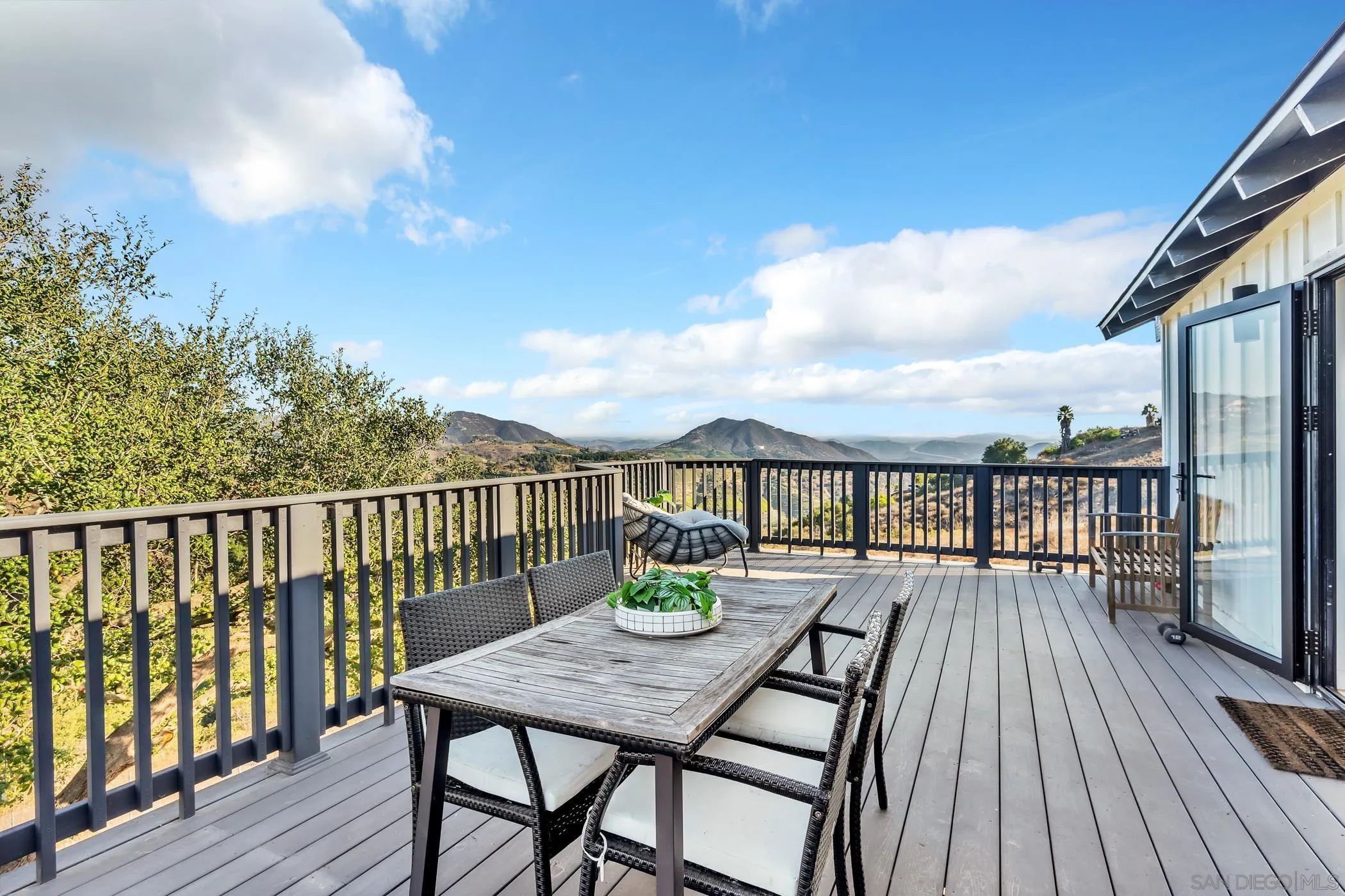 1029 Rainbow Valley Court Fallbrook, CA 92028 - Photo 55 of 75 a view of a balcony with wooden floor and seating space