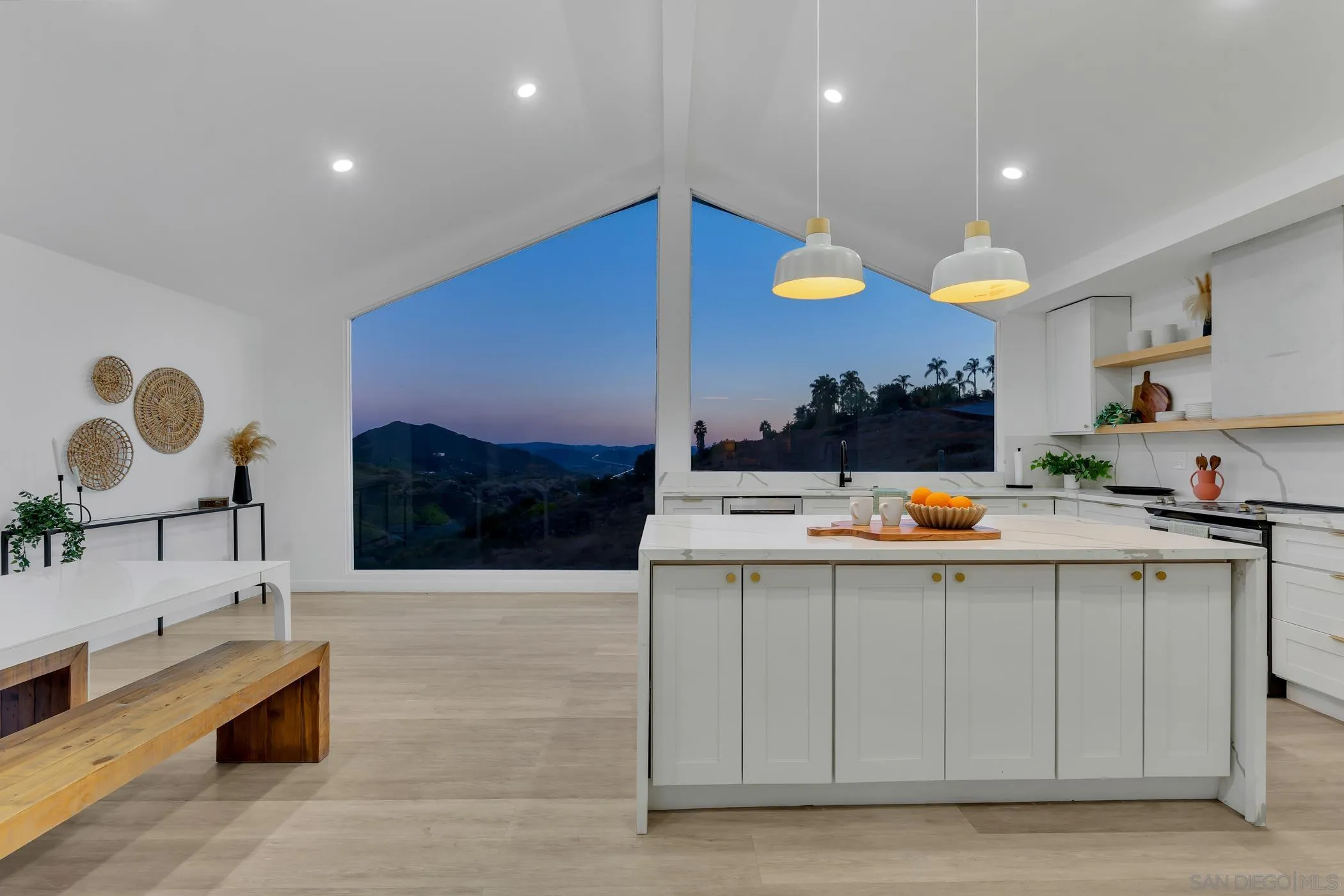 1029 Rainbow Valley Court Fallbrook, CA 92028 - Photo 9 of 75 a kitchen with stainless steel appliances kitchen island a white counter space and cabinets