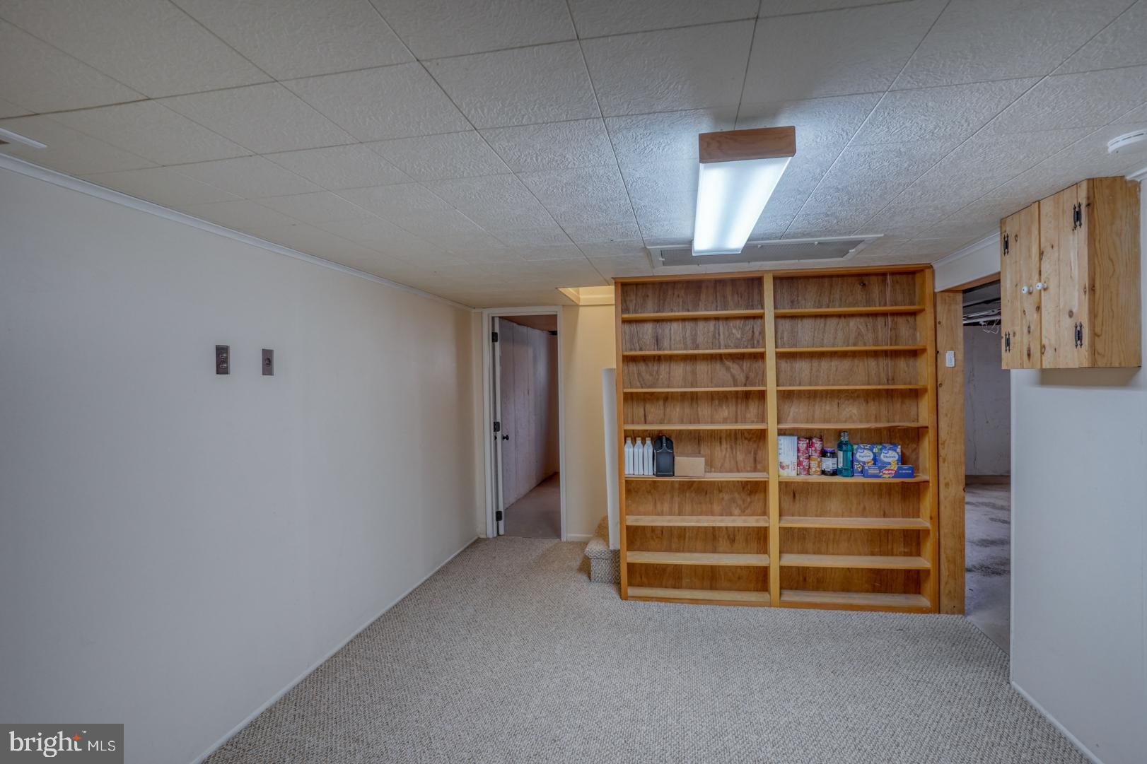 1245 Harrison Drive Dover, DE 19901 - Photo 20 of 47 a room with furniture and window