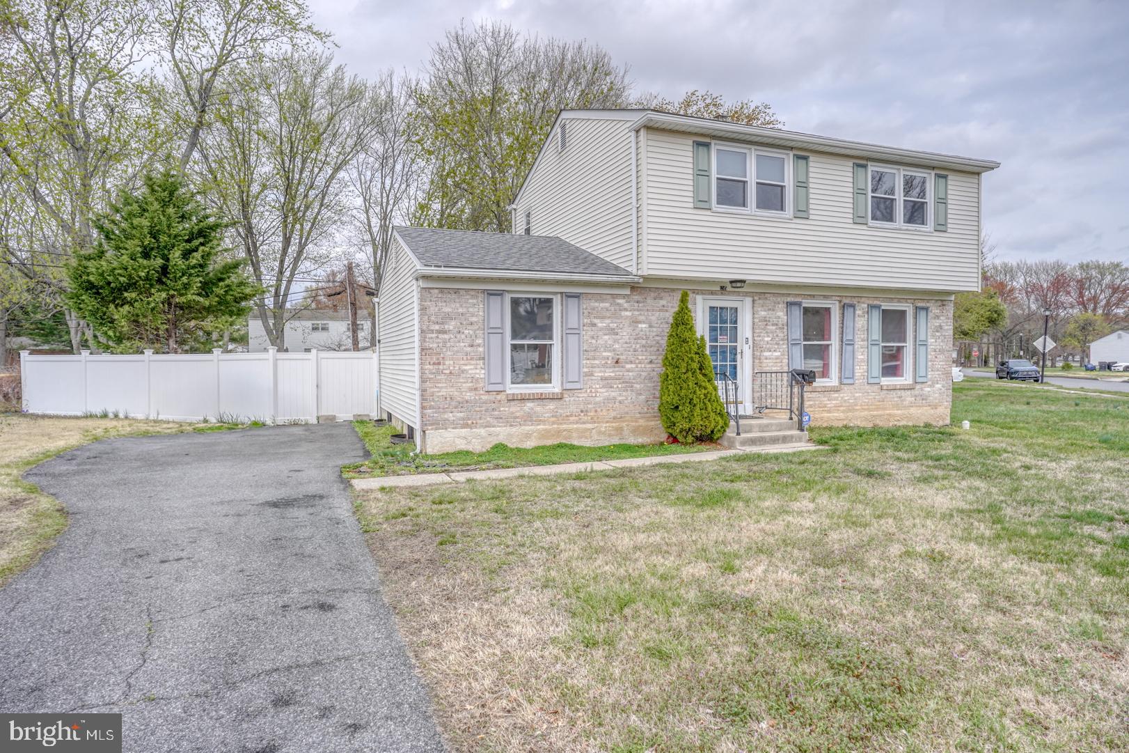 1245 Harrison Drive Dover, DE 19901 - Photo 2 of 47 front view of a house with a yard