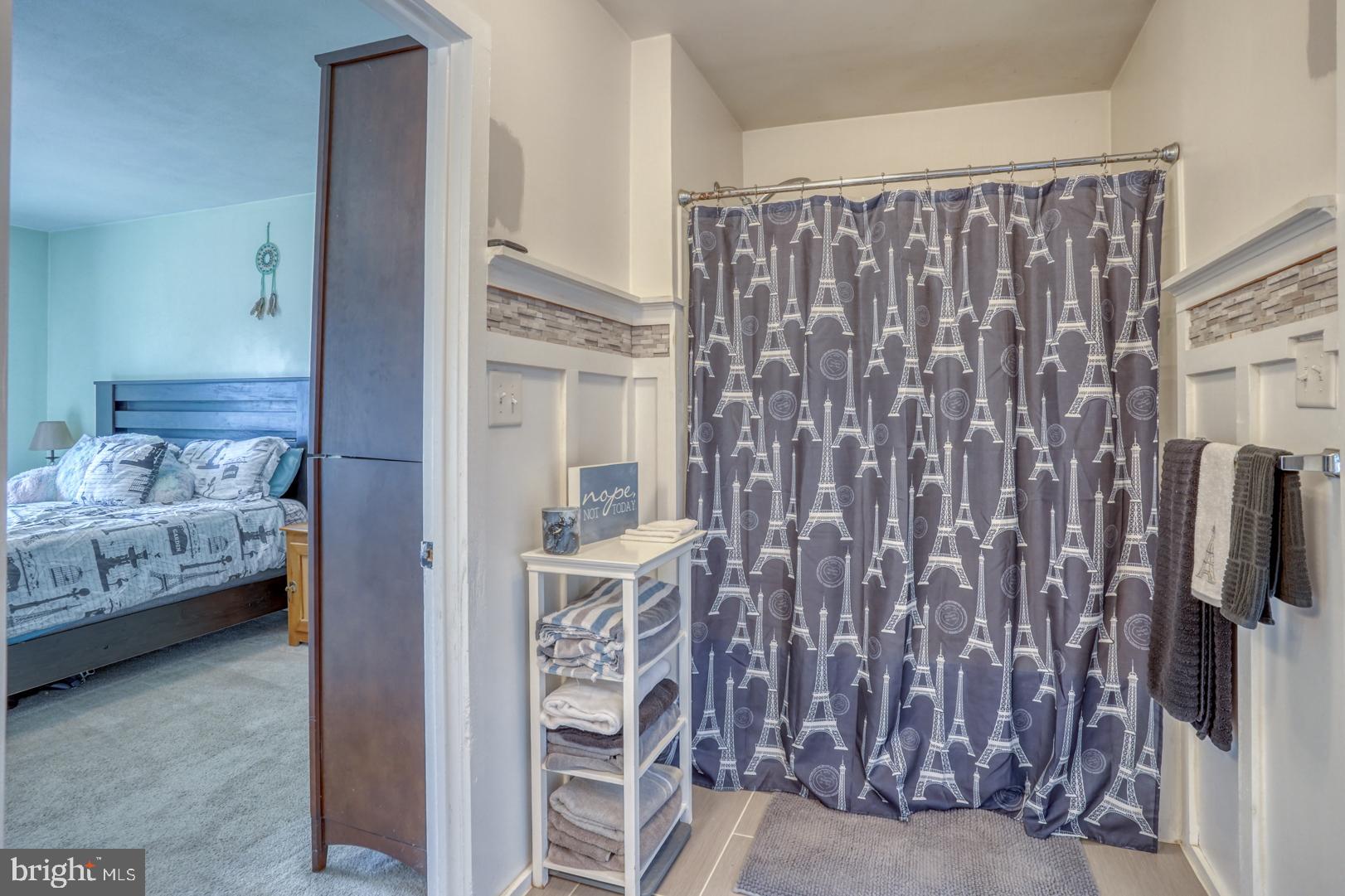 1245 Harrison Drive Dover, DE 19901 - Photo 25 of 47 a bedroom with a bed and a couch