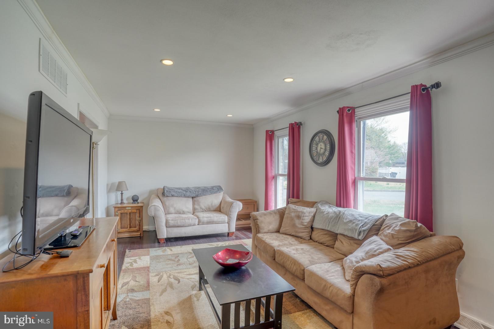 1245 Harrison Drive Dover, DE 19901 - Photo 28 of 47 a living room with furniture and a flat screen tv