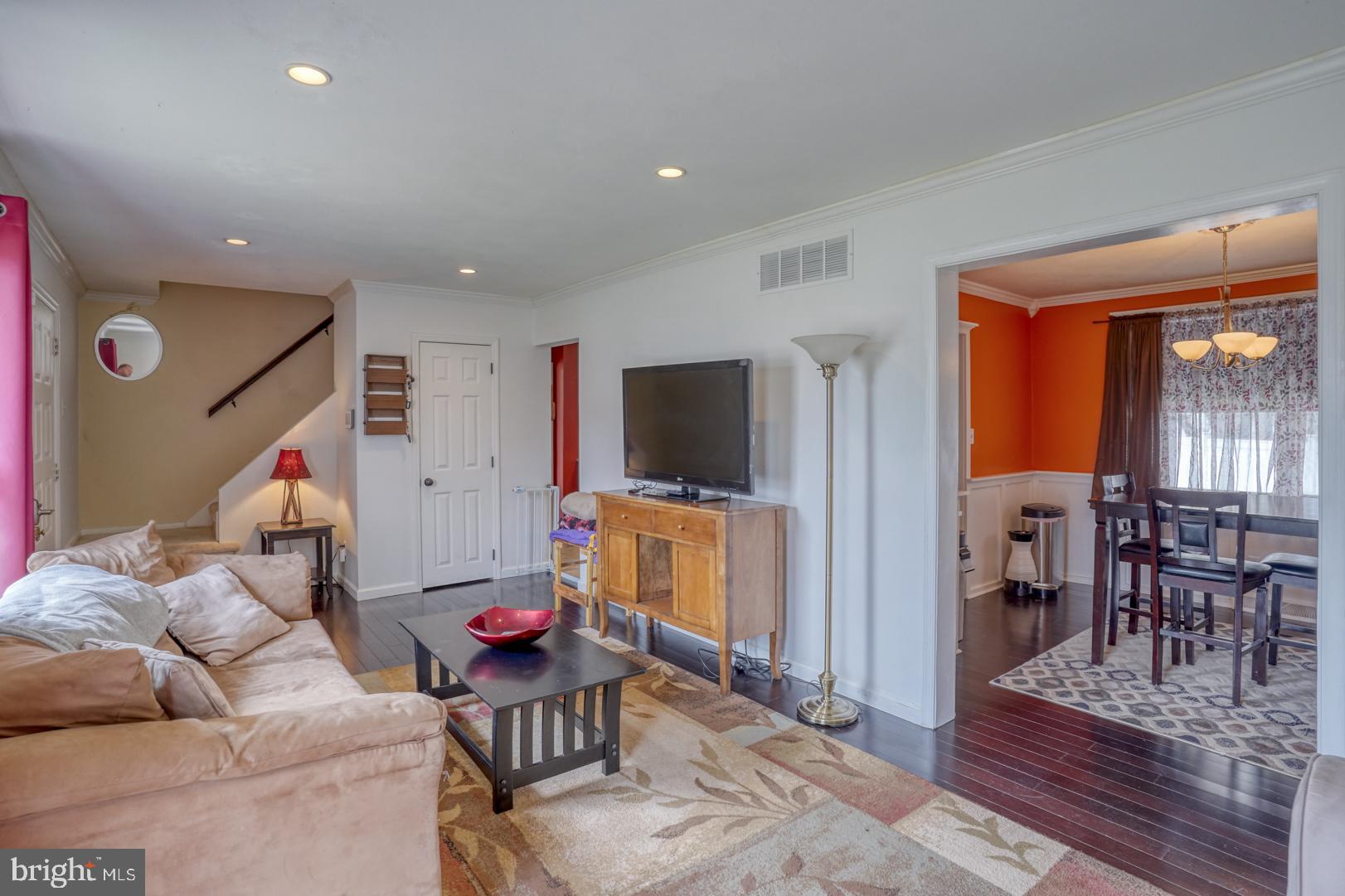 1245 Harrison Drive Dover, DE 19901 - Photo 31 of 47 a living room with furniture and a flat screen tv