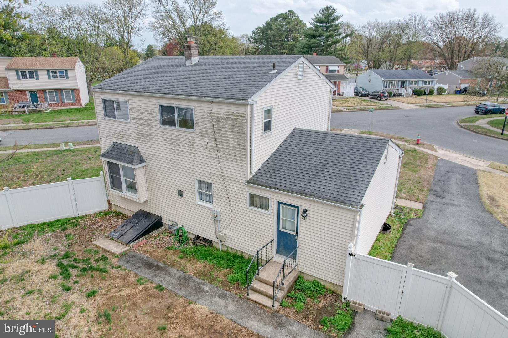 1245 Harrison Drive Dover, DE 19901 - Photo 41 of 47 a aerial view of a house next to a yard and road