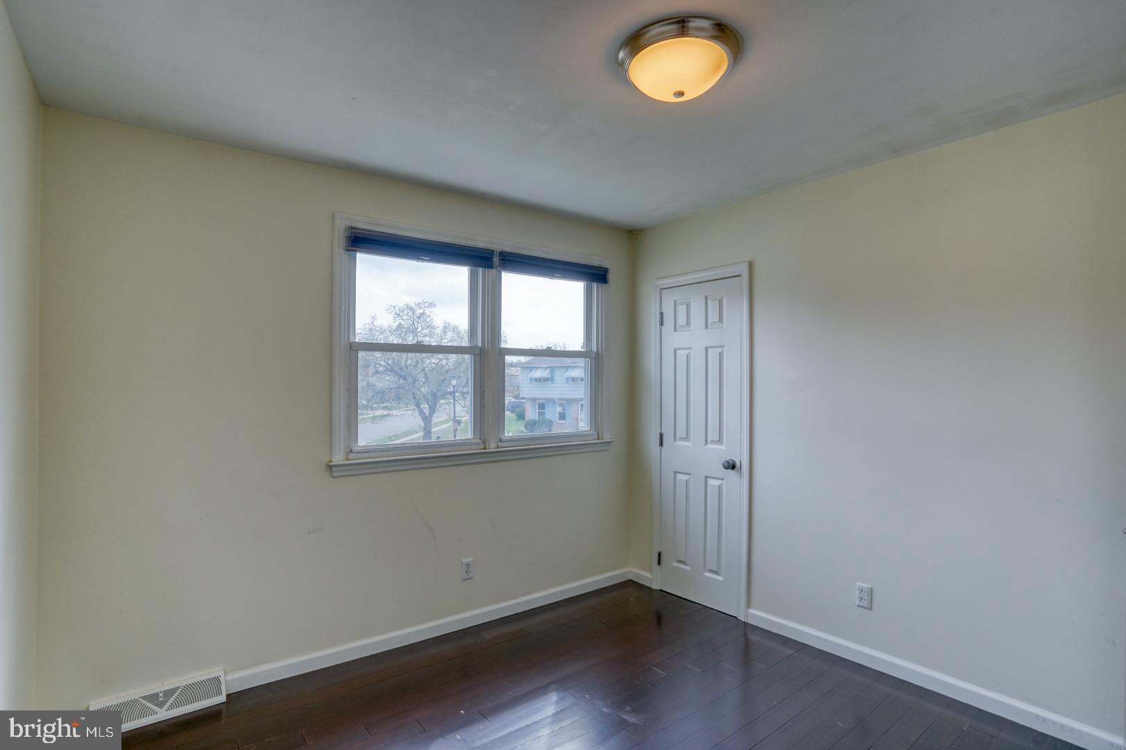 1245 Harrison Drive Dover, DE 19901 - Photo 6 of 47 an empty room with a window
