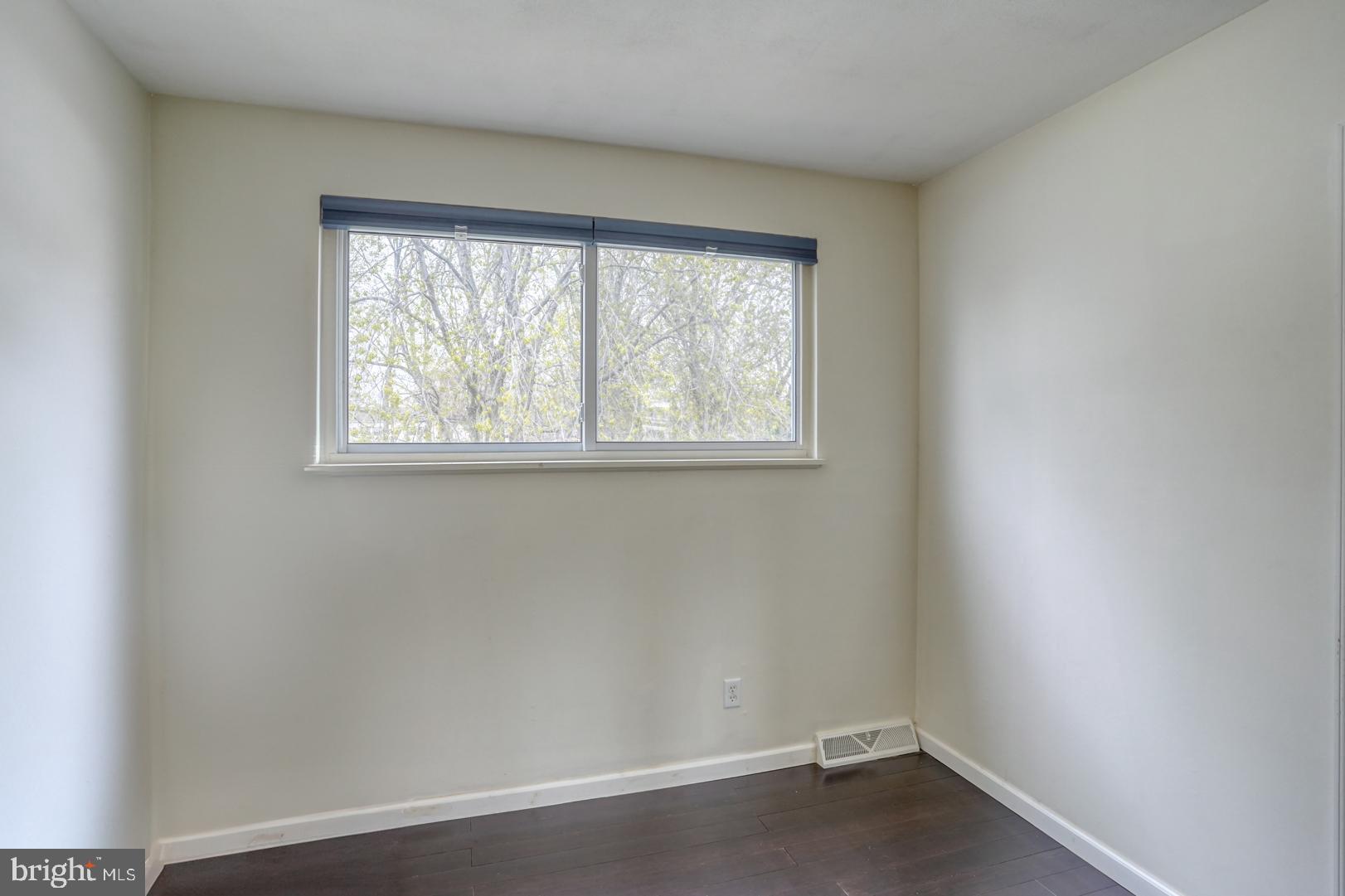 1245 Harrison Drive Dover, DE 19901 - Photo 8 of 47 an empty room with a window