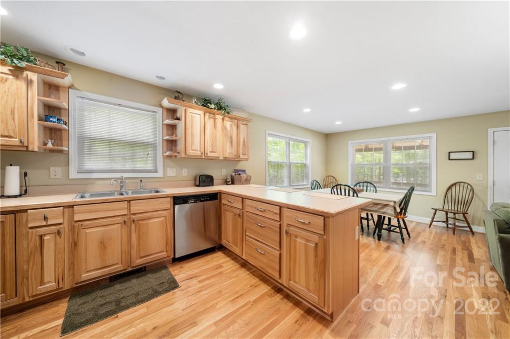 204 Nottingham Road Maggie Valley, NC 28751 - Photo 17 of 46 a large kitchen with lots of counter top space and dining table