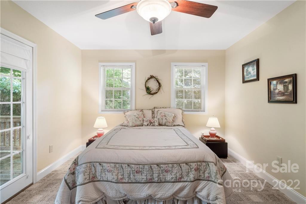 204 Nottingham Road Maggie Valley, NC 28751 - Photo 20 of 46 a bedroom with a large bed and a window