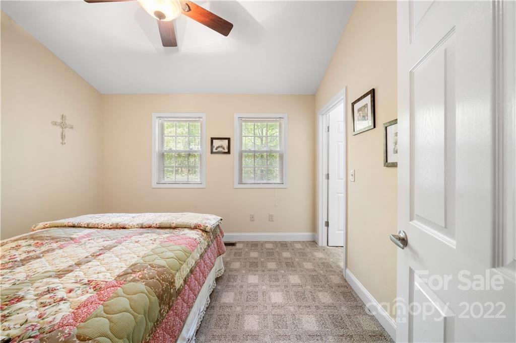 204 Nottingham Road Maggie Valley, NC 28751 - Photo 29 of 46 a bedroom with a bed and a window