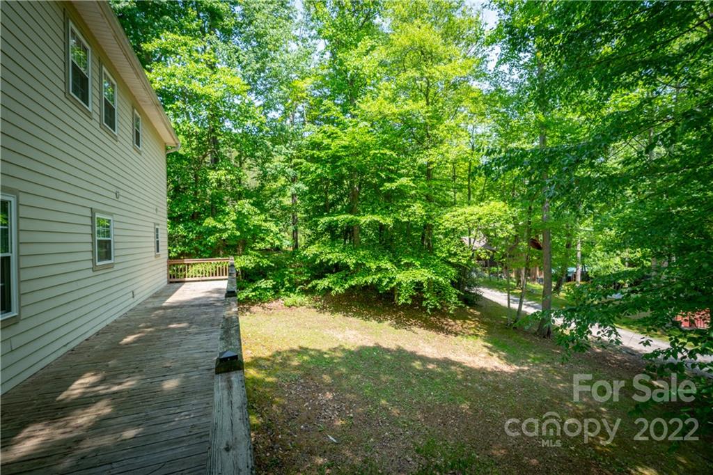 204 Nottingham Road Maggie Valley, NC 28751 - Photo 44 of 46 a backyard of a house with lots of green space