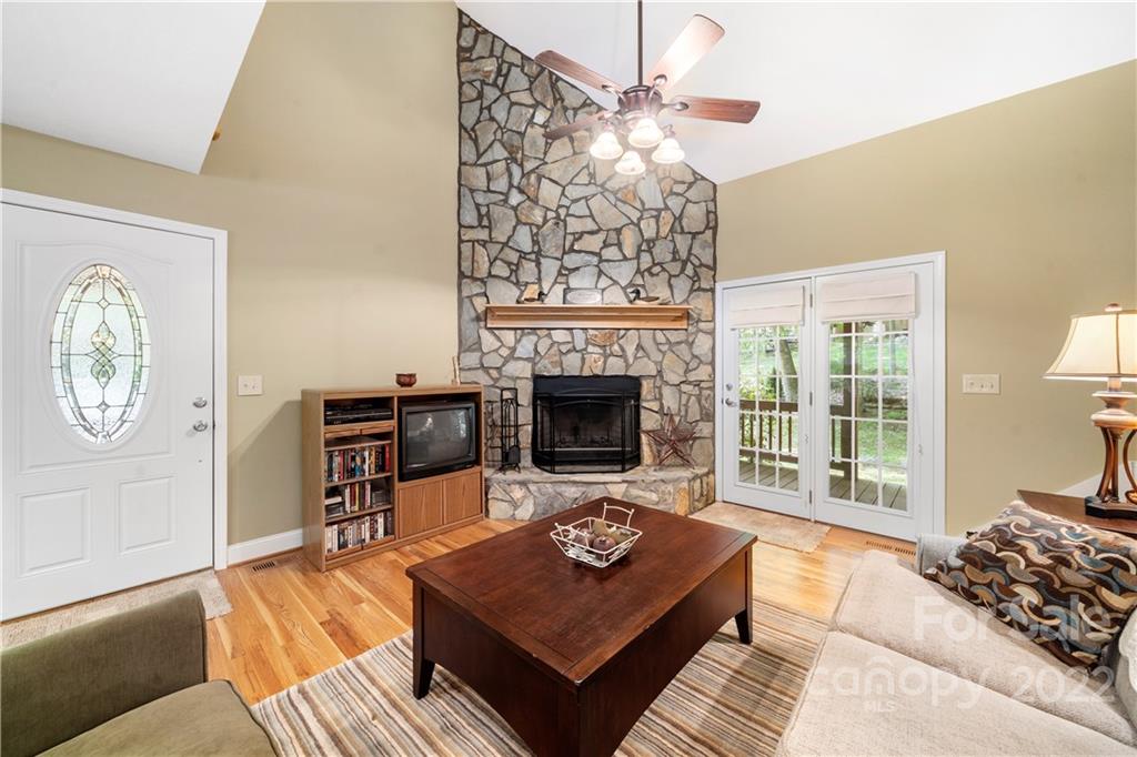 204 Nottingham Road Maggie Valley, NC 28751 - Photo 10 of 46 a living room with furniture a rug and a fireplace