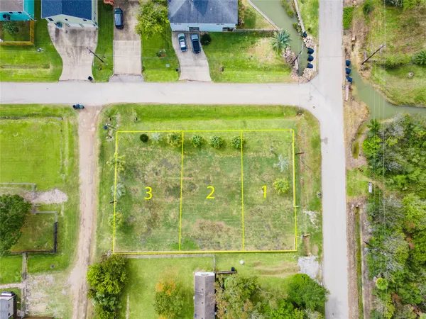 a view of a pool with a table and chairs