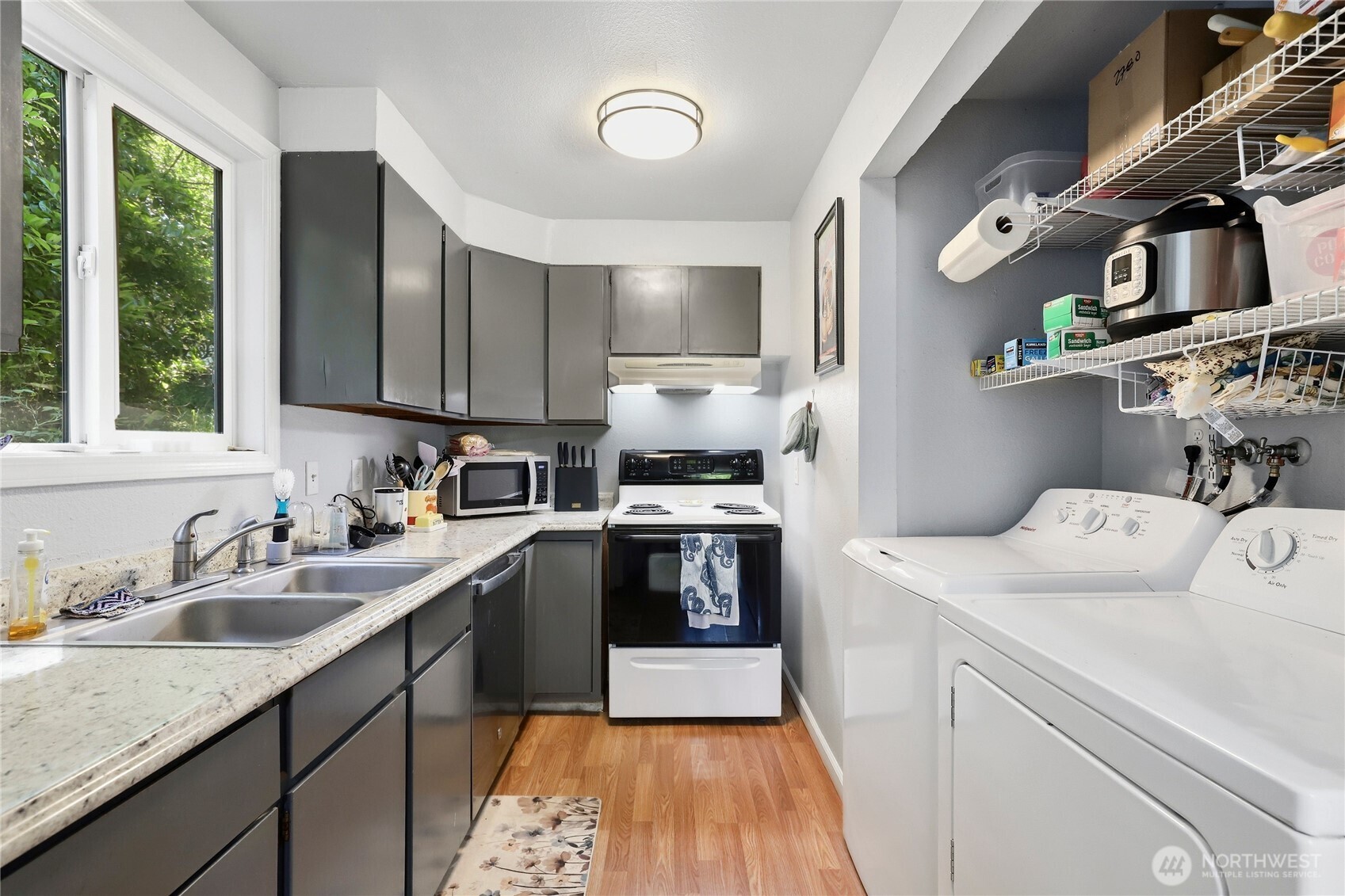2533 Fir Avenue Bremerton, WA 98310 - Photo 12 of 38 a kitchen with a sink cabinets and stainless steel appliances